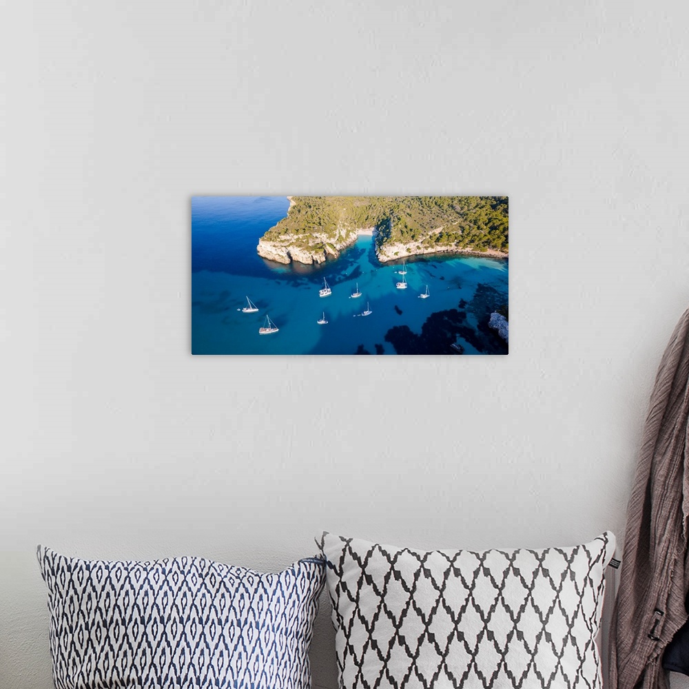 A bohemian room featuring Aerial view of coastline and beach, Cala Macarella, Menorca, Balearic Islands, Spain.