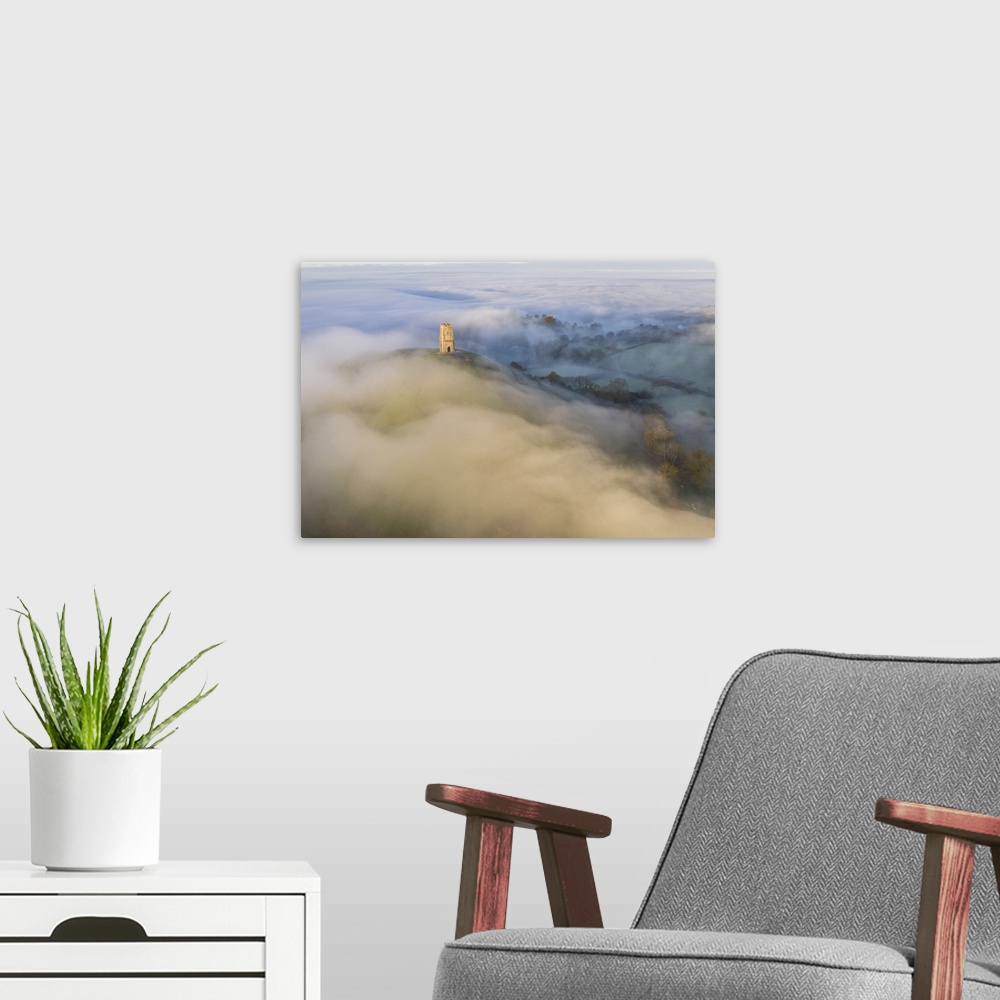 A modern room featuring Aerial view of Glastonbury Tor surrounded by morning mist, Glastonbury, Somerset, England