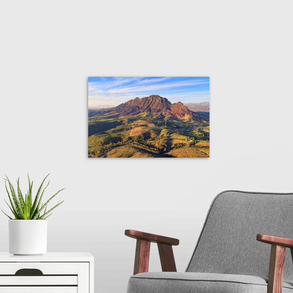 A modern room featuring South Africa, Western Cape, Stellenbosch, Aerial view of Simonsberg Mountain range and Stellenbos...