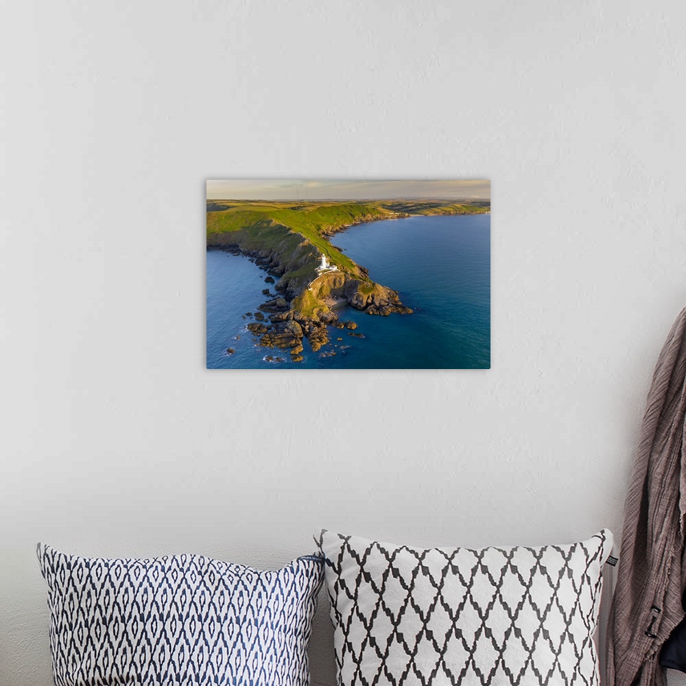 A bohemian room featuring Aerial view of Start Point lighthouse and headland, South Hams, Devon, England. Summer (July) 2020.