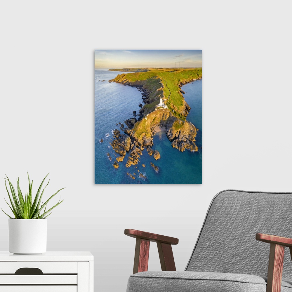 A modern room featuring Aerial view of Start Point lighthouse and headland, South Hams, Devon, England. Summer (July) 2020.