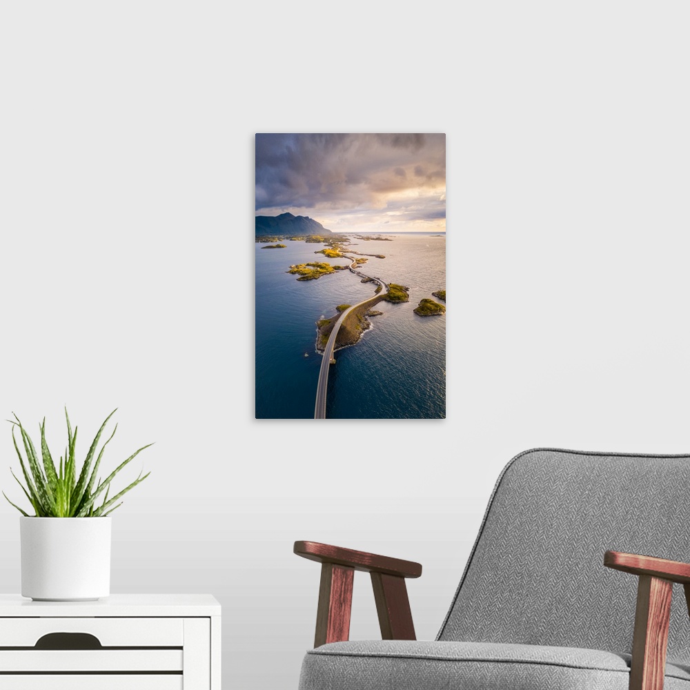 A modern room featuring Aerial view of the Atlantic Ocean Road at sunset, More og Romsdal, Norway