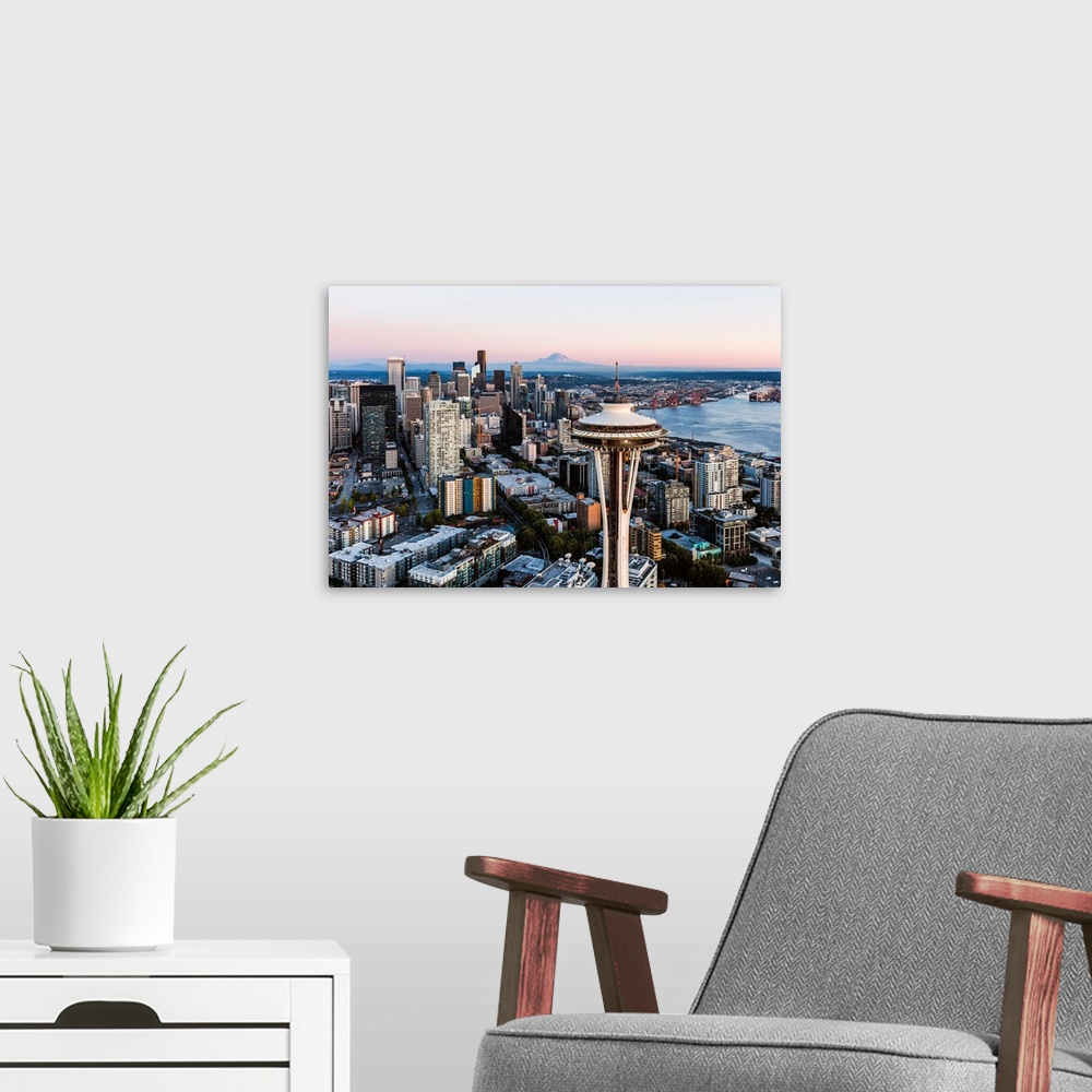 A modern room featuring Aerial View Of The Space Needle And Downtown Skyline At Sunset With Mt Rainier In The Background,...