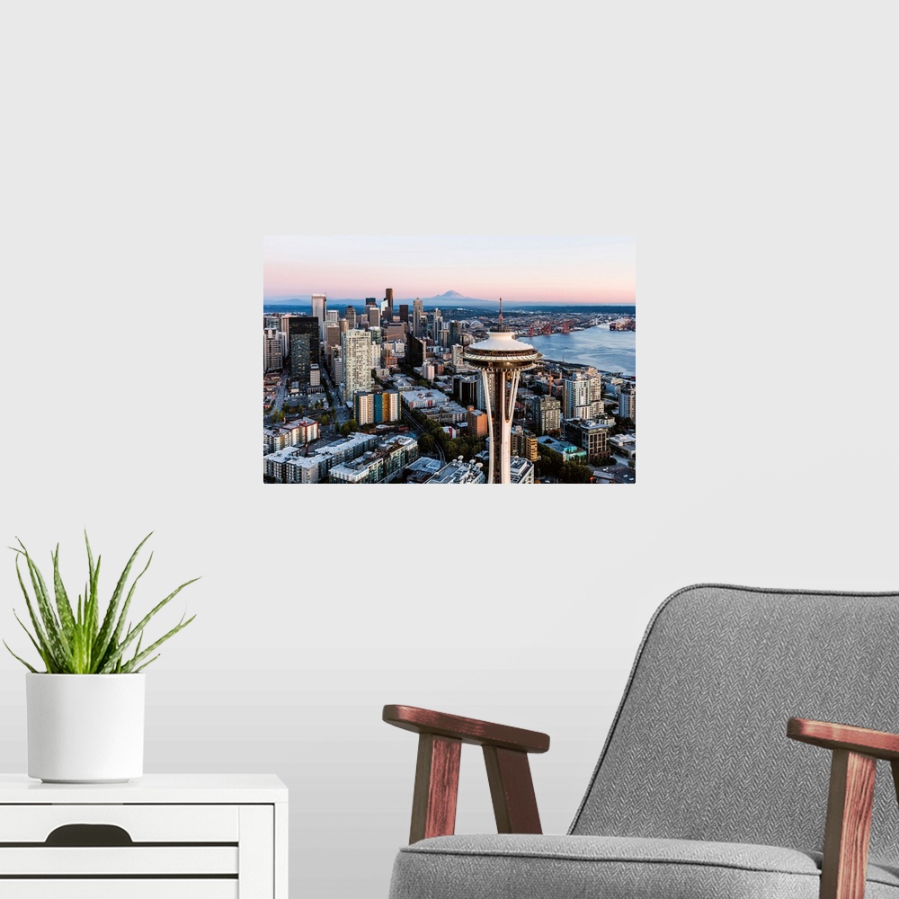 A modern room featuring Aerial View Of The Space Needle And Downtown Skyline At Sunset With Mt Rainier In The Background,...