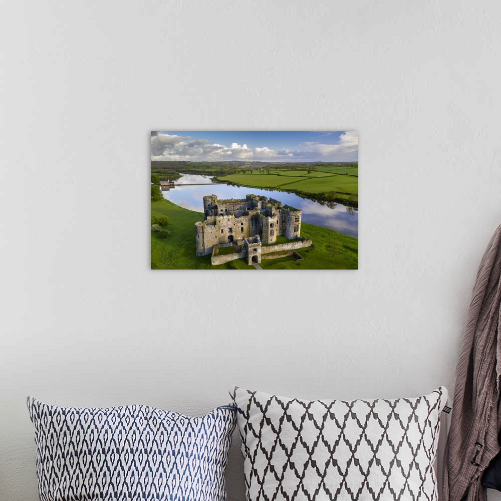 A bohemian room featuring Aerial vista of Carew Castle in Pembrokeshire Coast National Park, Wales, UK. Spring (May) 2021.