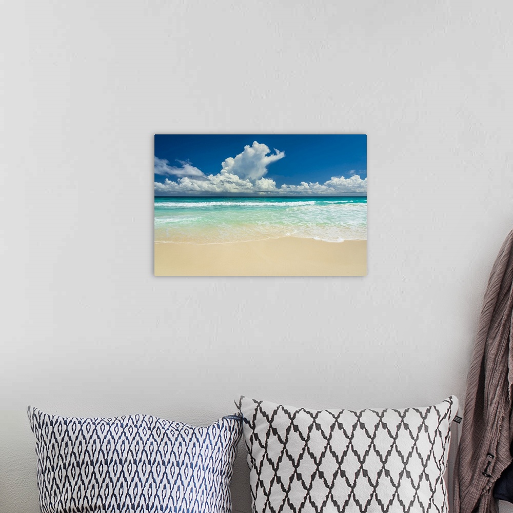 A bohemian room featuring Africa, Seychelles, La Digue. Beach, sand, waves, clouds at Grand Anse.