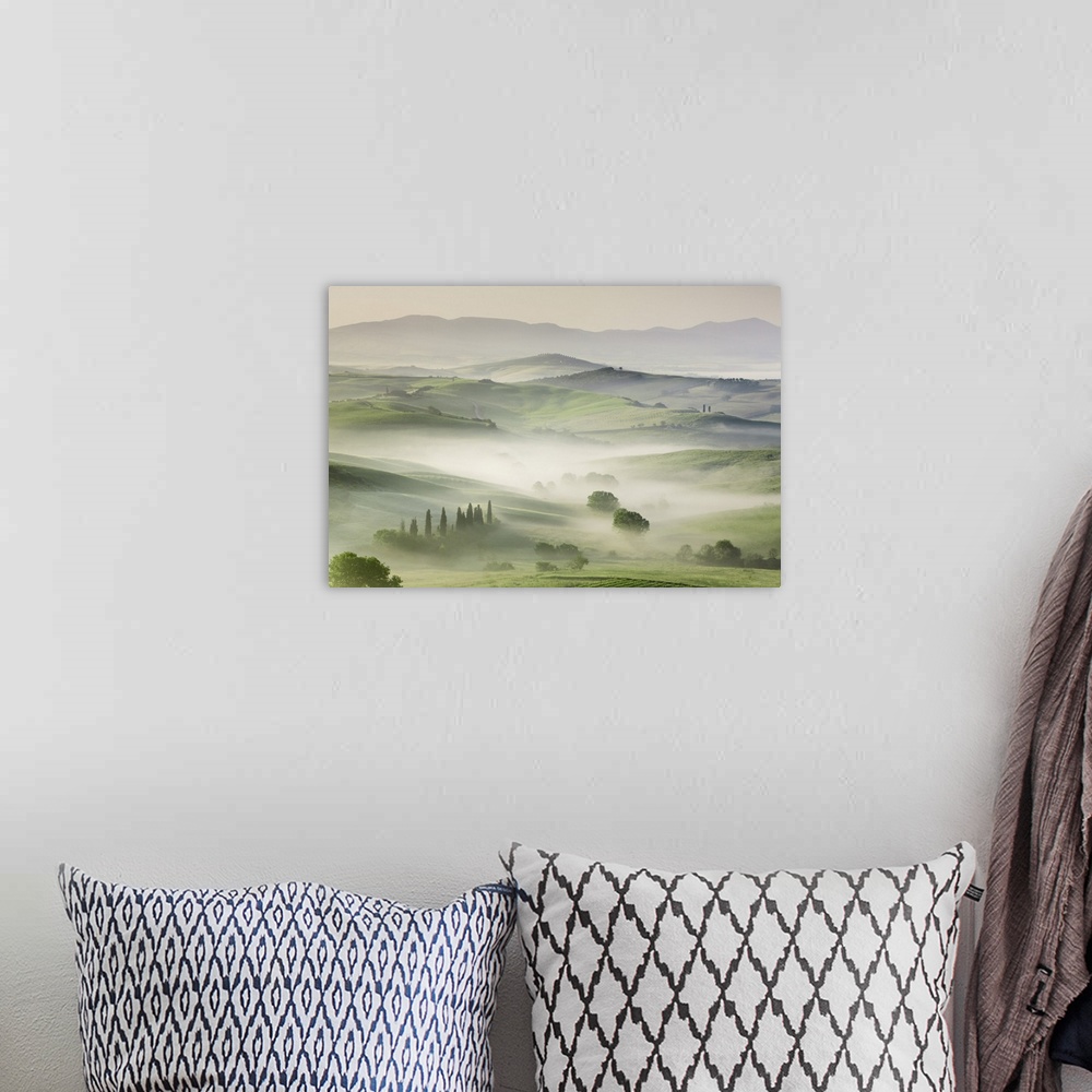 A bohemian room featuring Agricultural landscape in fog. Italy, Tuscany, Siena, Val d'Orcia, San Quirico d'Orcia. Tuscany, ...