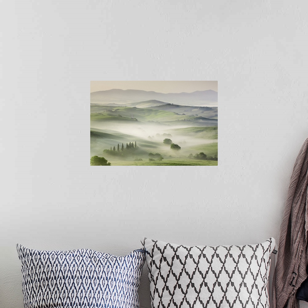 A bohemian room featuring Agricultural landscape in fog. Italy, Tuscany, Siena, Val d'Orcia, San Quirico d'Orcia. Tuscany, ...
