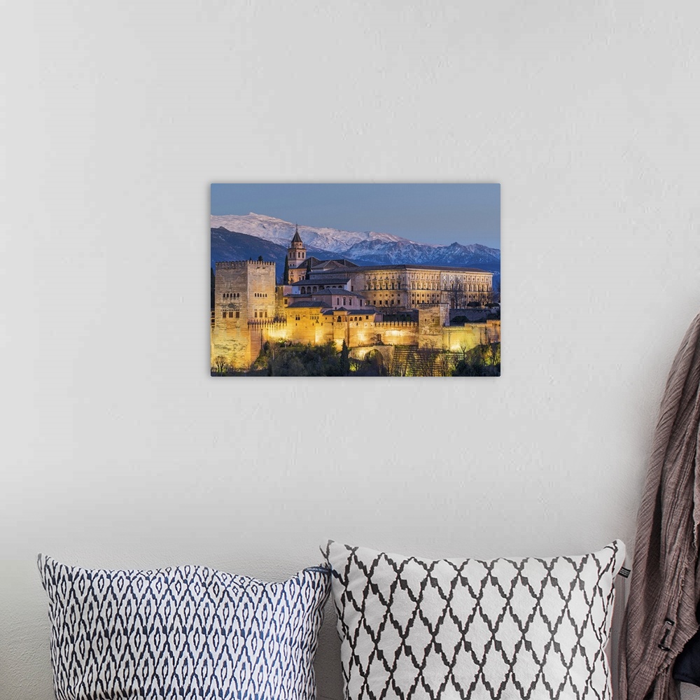 A bohemian room featuring View at dusk of Alhambra palace with the snowy Sierra Nevada in the background, Granada, Andalusi...