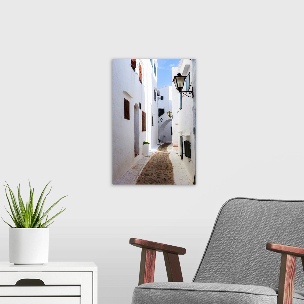 A modern room featuring Alley in the old town of Binibequer Vell, Menorca, Balearic Islands, Spain.
