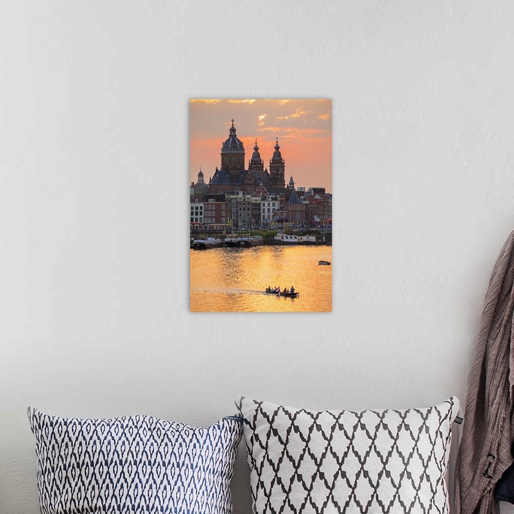 A bohemian room featuring Netherlands, North Holland, Amsterdam. City skyline at sunset with domes of Basilica of Saint Nic...
