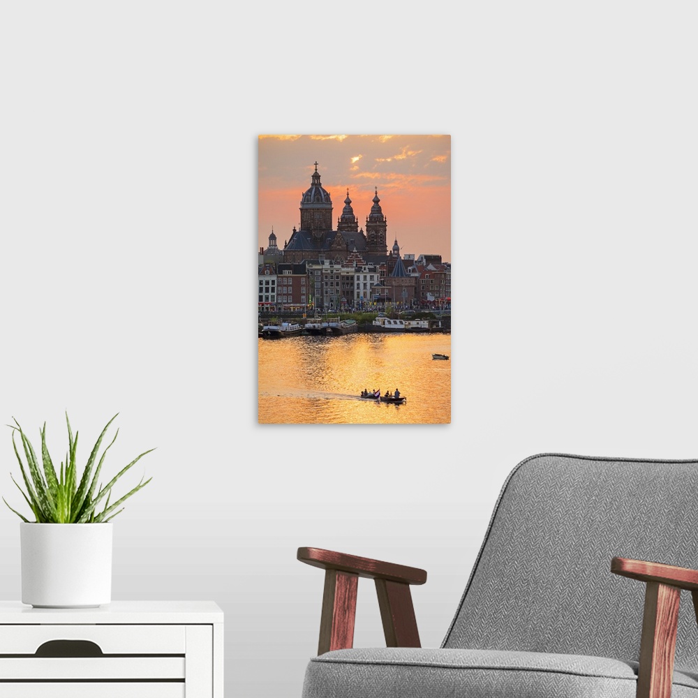 A modern room featuring Netherlands, North Holland, Amsterdam. City skyline at sunset with domes of Basilica of Saint Nic...