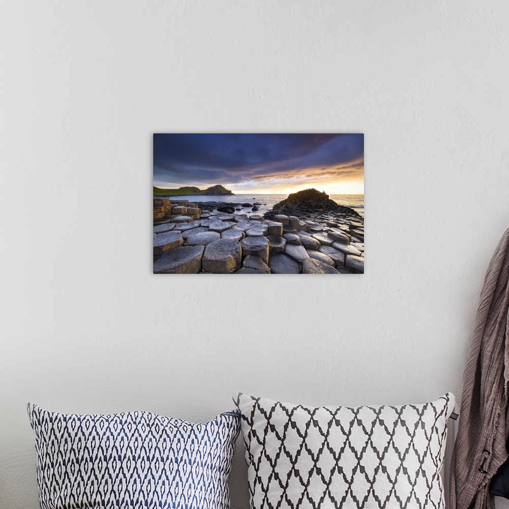 A bohemian room featuring An epic sunset at the Giant's Causeway with it's iconic basalt columns. County Antrim, Ulster reg...