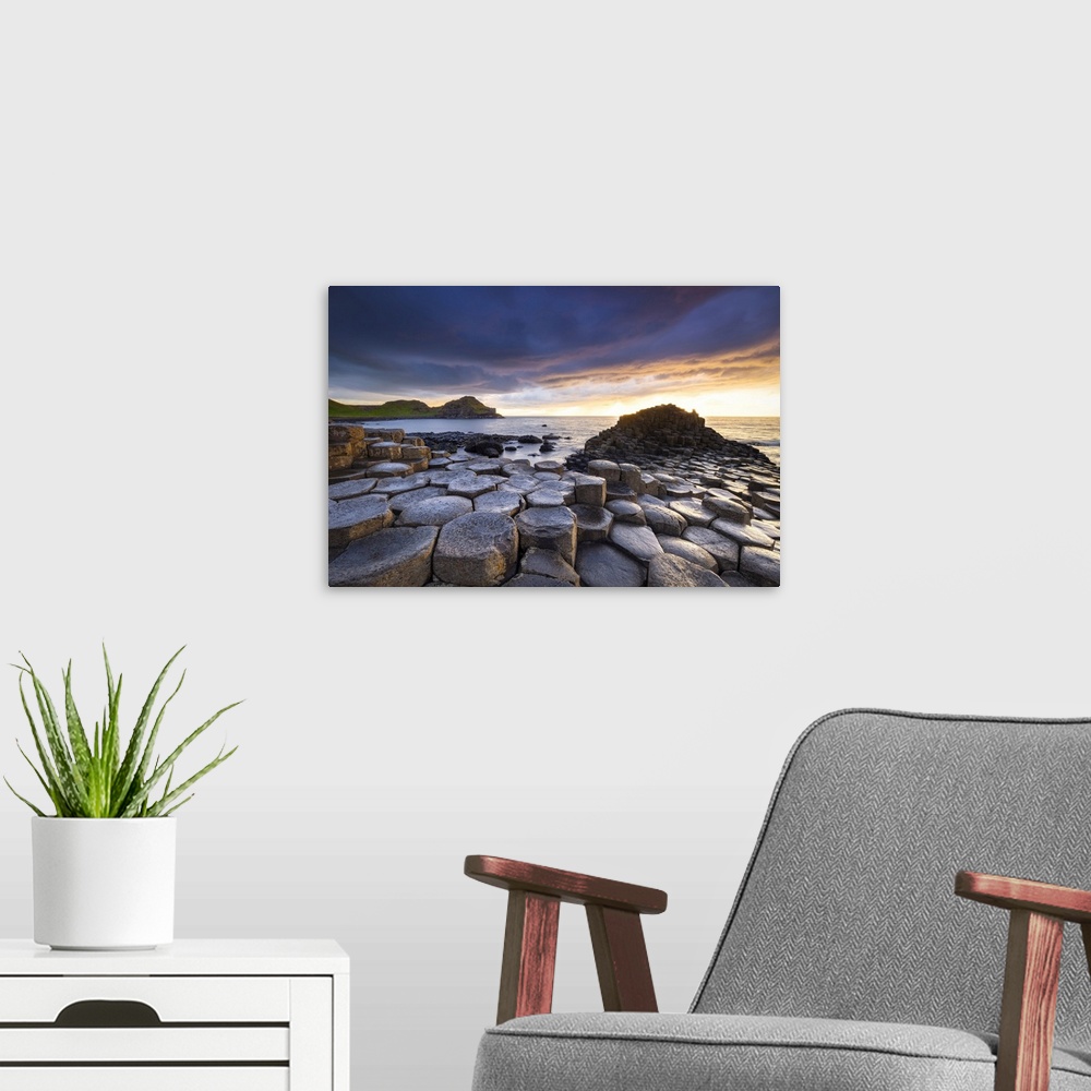 A modern room featuring An epic sunset at the Giant's Causeway with it's iconic basalt columns. County Antrim, Ulster reg...