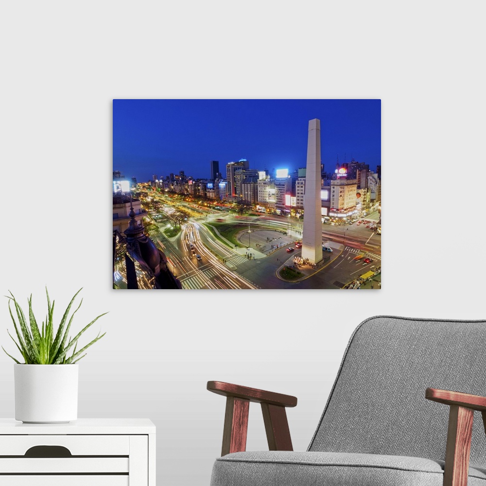 A modern room featuring Argentina, Buenos Aires Province, City of Buenos Aires, Twilight view of 9 de Julio Avenue, Plaza...