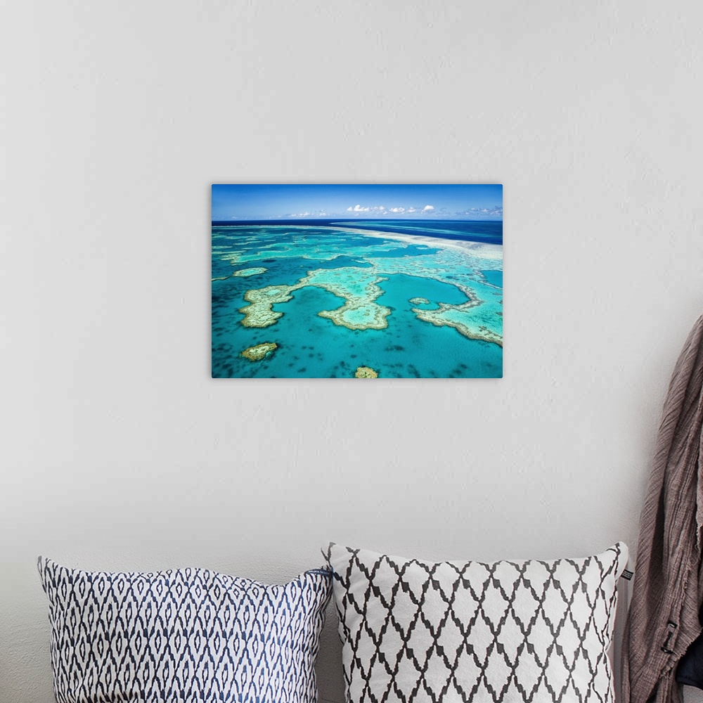 A bohemian room featuring Australia, Queensland, Whitsundays, Great Barrier Reef Marine Park. Aerial view of coral formatio...
