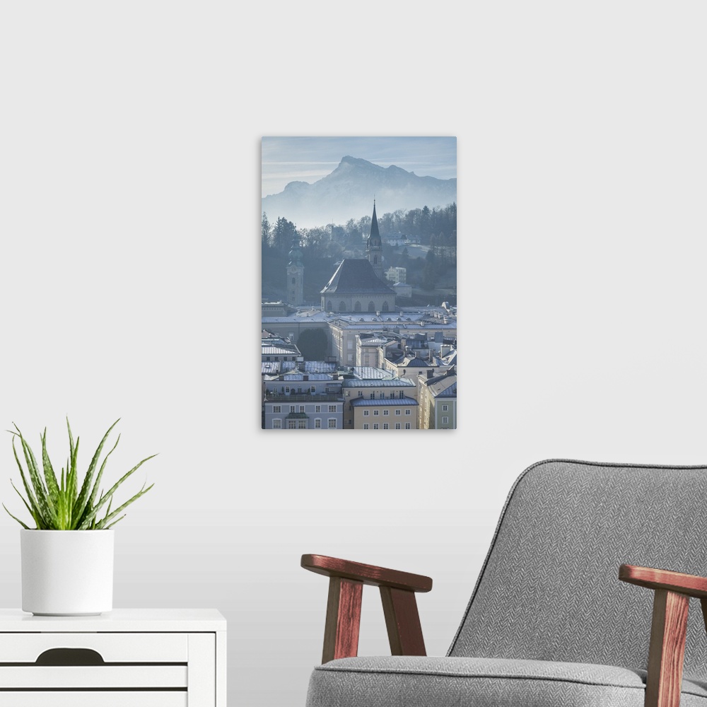 A modern room featuring Austria, Salzburgerland, Salzburg, elevated city view from the Kapuzinerberg, morning, winter