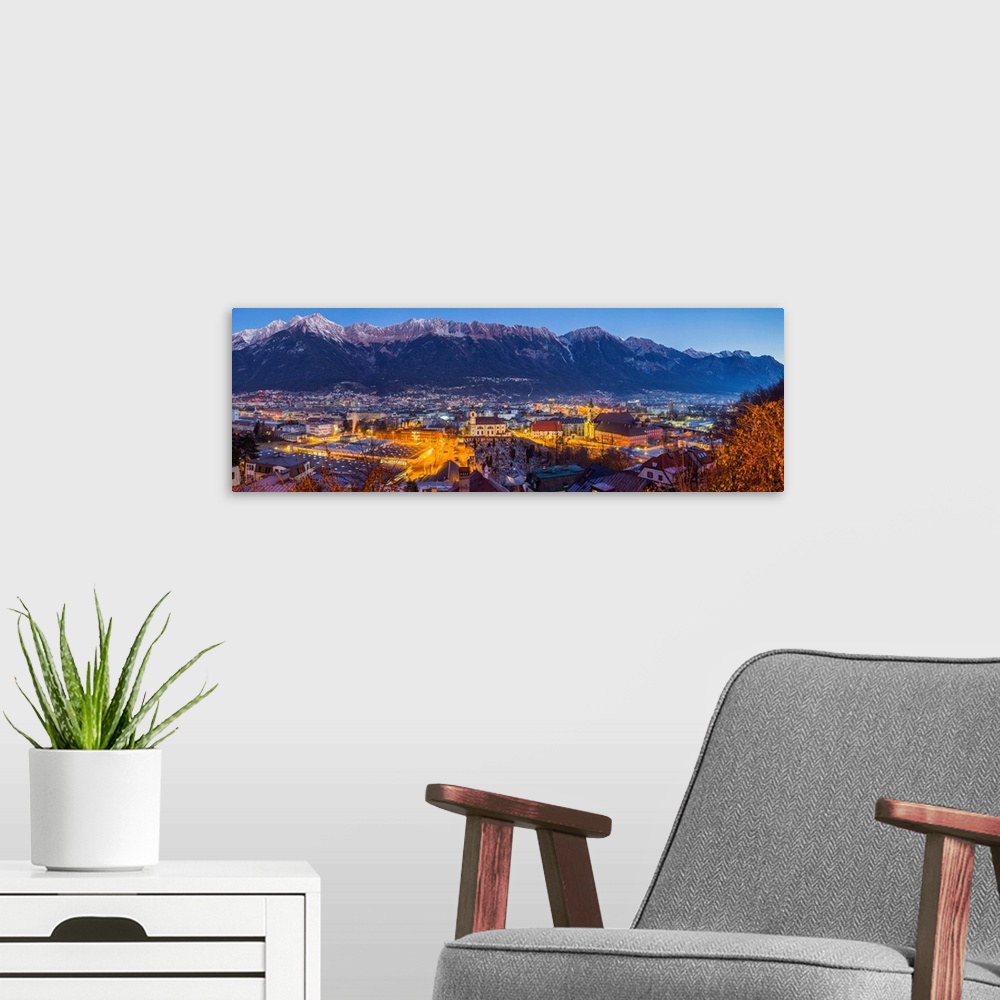 A modern room featuring Austria, Tyrol,  Innsbruck, elevated city view with the Wilten Basilica and Wilten Abbey Church, ...