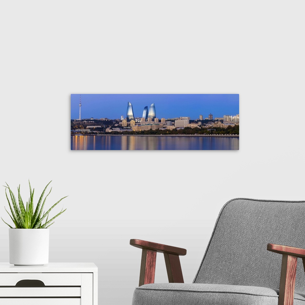 A modern room featuring Azerbaijan, Baku, View of the Flame Towers reflecting in the Caspian Sea