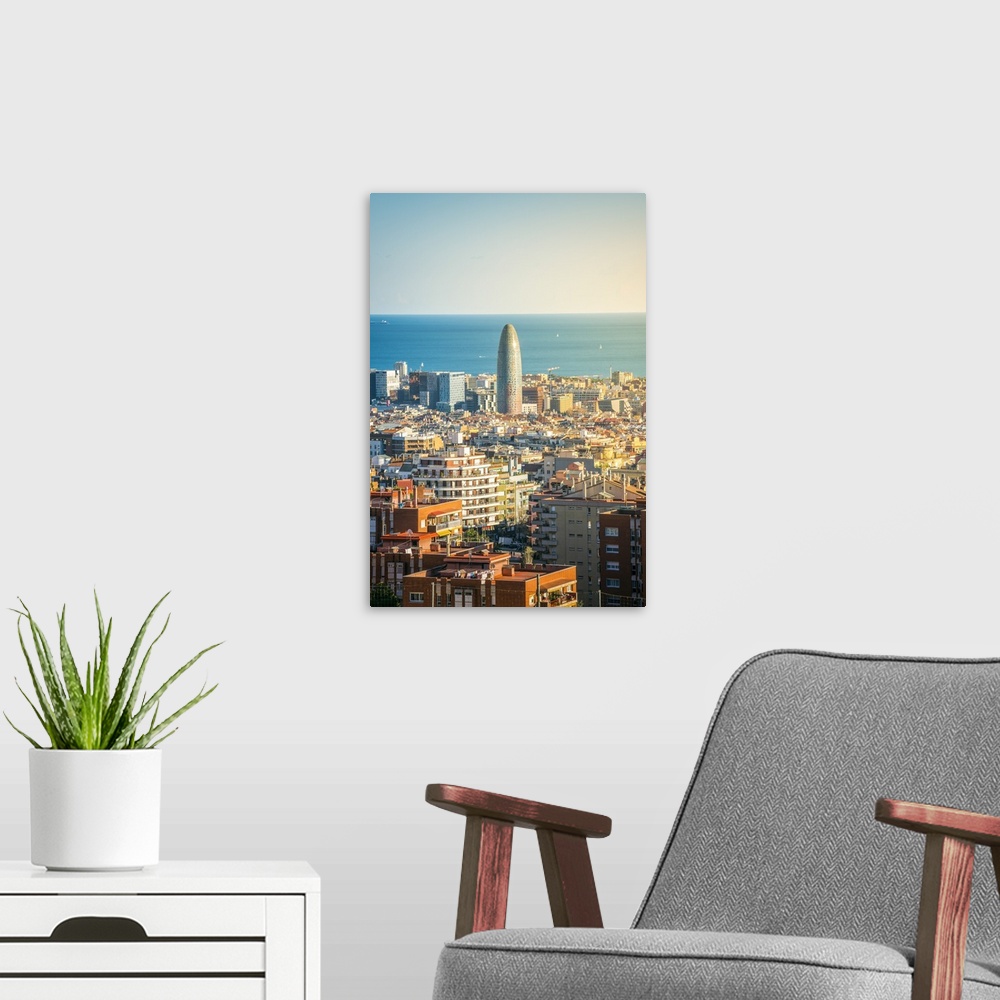 A modern room featuring Barcelona, Catalonia, Spain, Southern Europe. High angle view of the city with the Agbar Tower an...