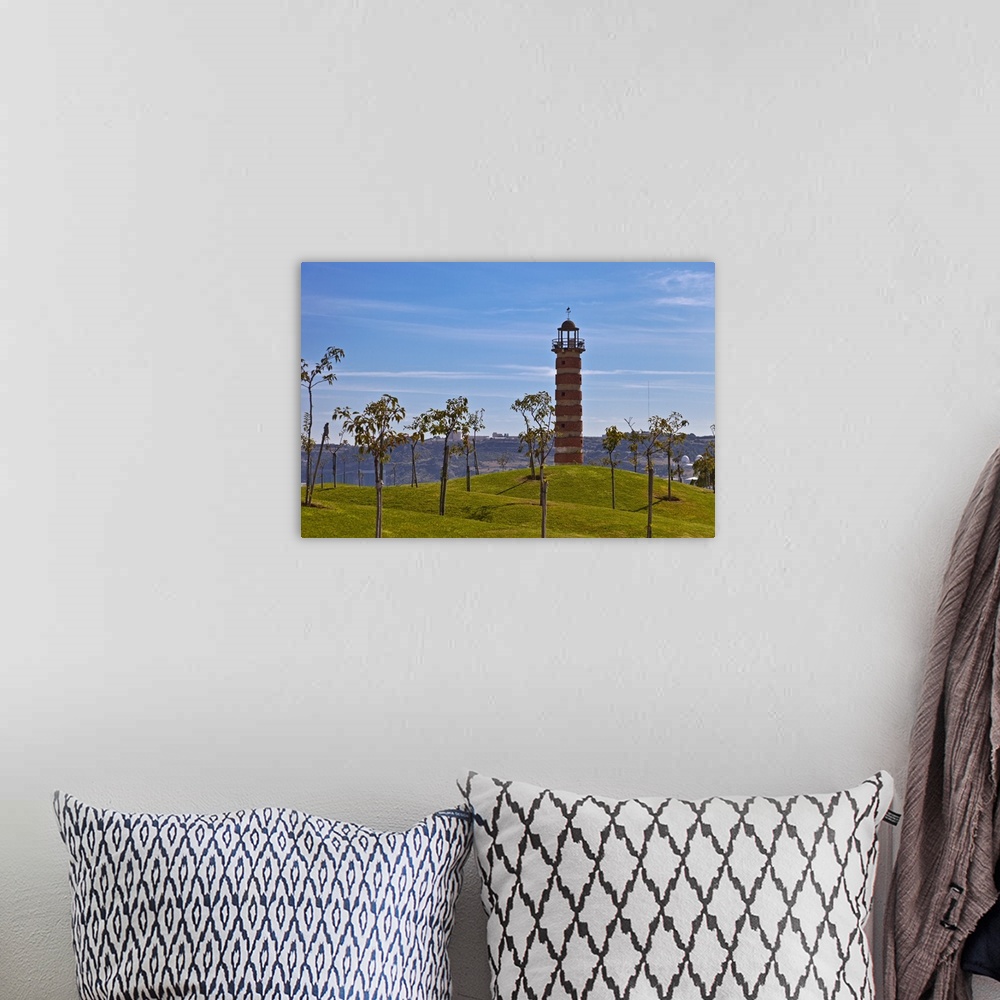A bohemian room featuring Belem Lighthouse at the entrance to the River Tagus Estuary with landscaped mounds and trees in t...
