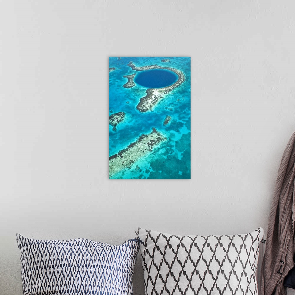 A bohemian room featuring Central America, Belize, Lighthouse atoll, the Great Blue Hole, aerial shot of the Blue Hole. The...