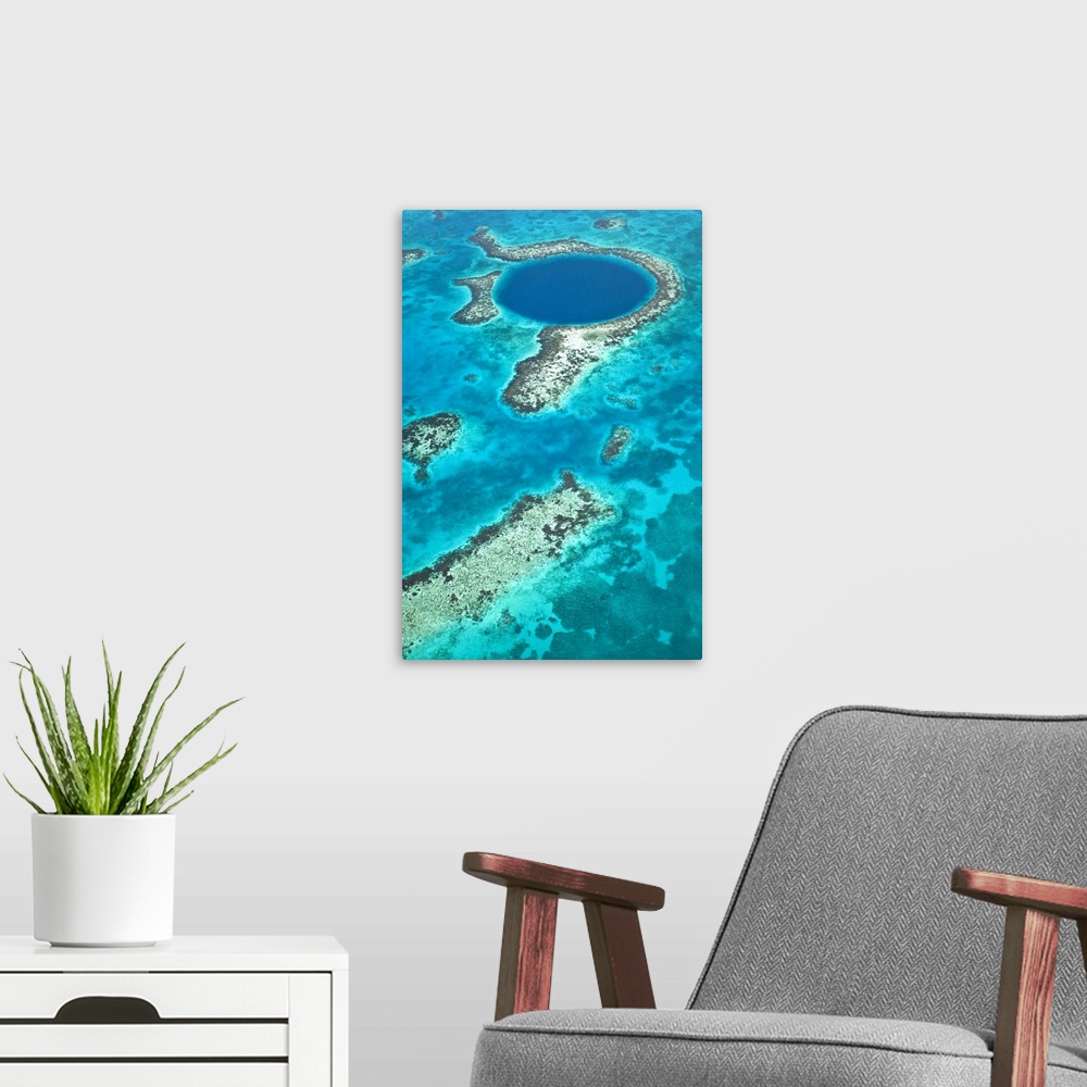 A modern room featuring Central America, Belize, Lighthouse atoll, the Great Blue Hole, aerial shot of the Blue Hole. The...