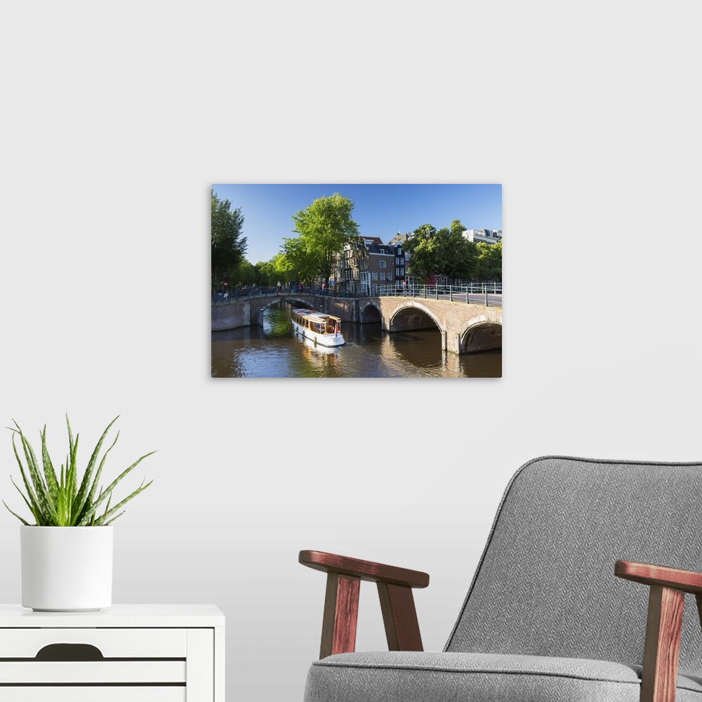 A modern room featuring Boat on Prinsengracht canal, Amsterdam, Netherlands.