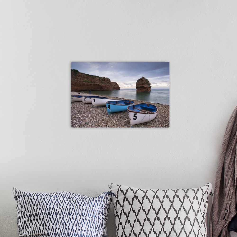 A bohemian room featuring Boats pulled up on the shingle at Ladram Bay on the Jurassic Coast, Devon, England. Autumn (Septe...