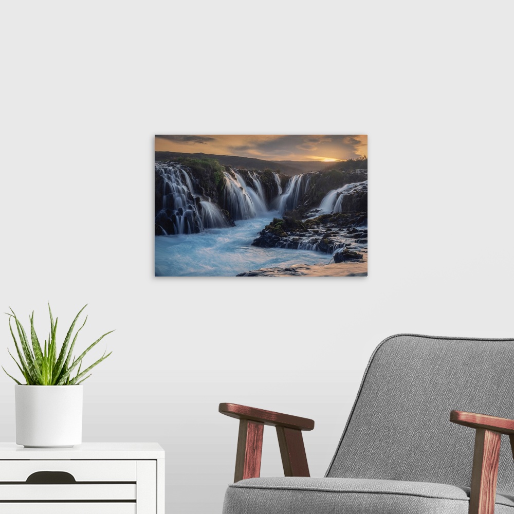 A modern room featuring Bruarfoss waterfall, Iceland