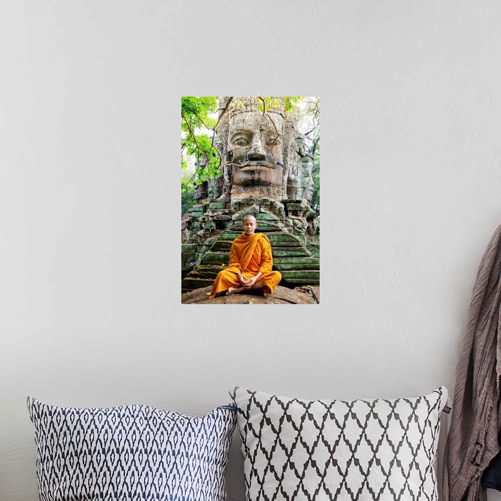 A bohemian room featuring Southeast Asia, Cambodia, Siem Reap, Angkor Temples, Buddhist Monk In Saffron Robes Meditating (MR)