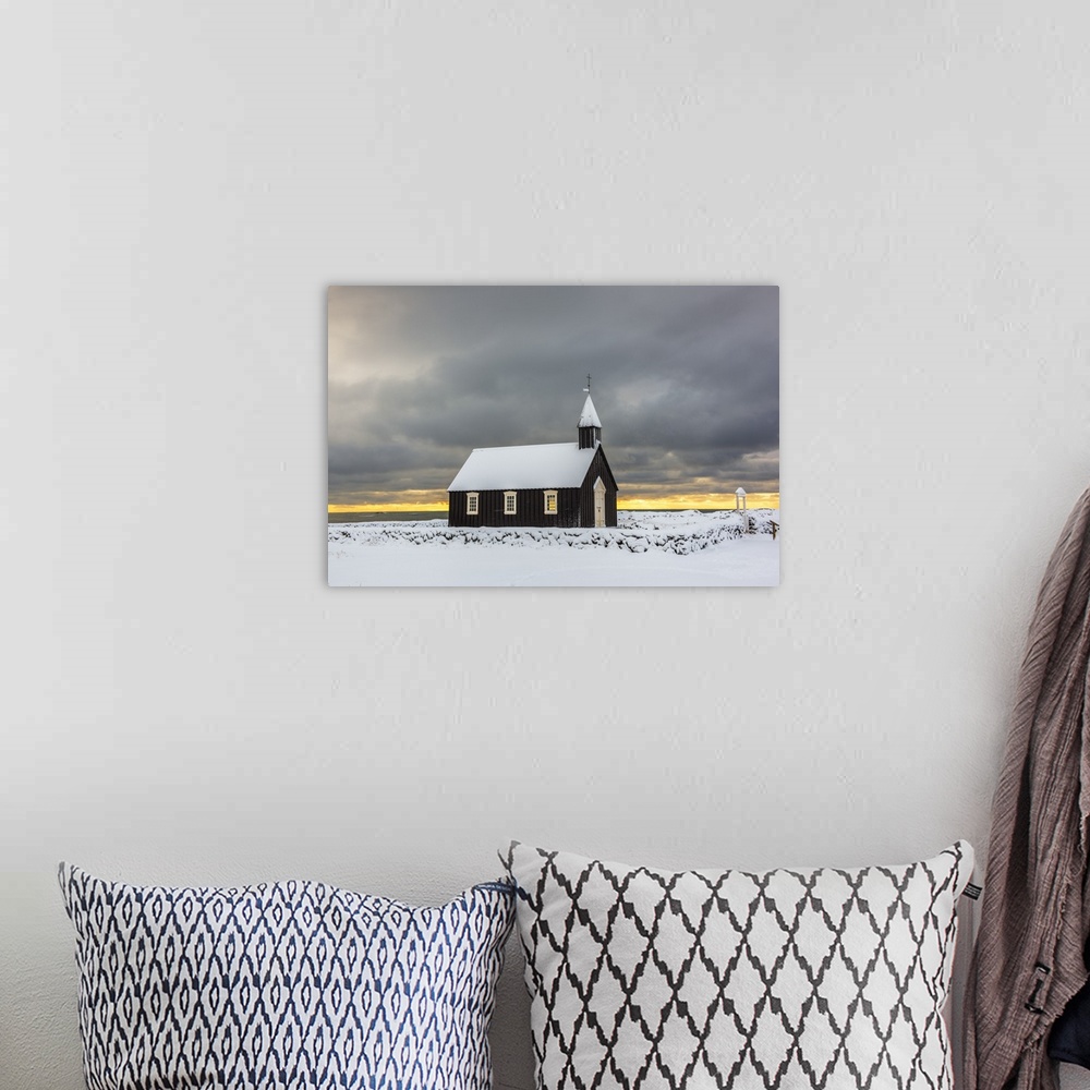 A bohemian room featuring Budir, Snaefellsnes Peninsula, Western Iceland, Iceland. Black church surrounded by the snow in w...