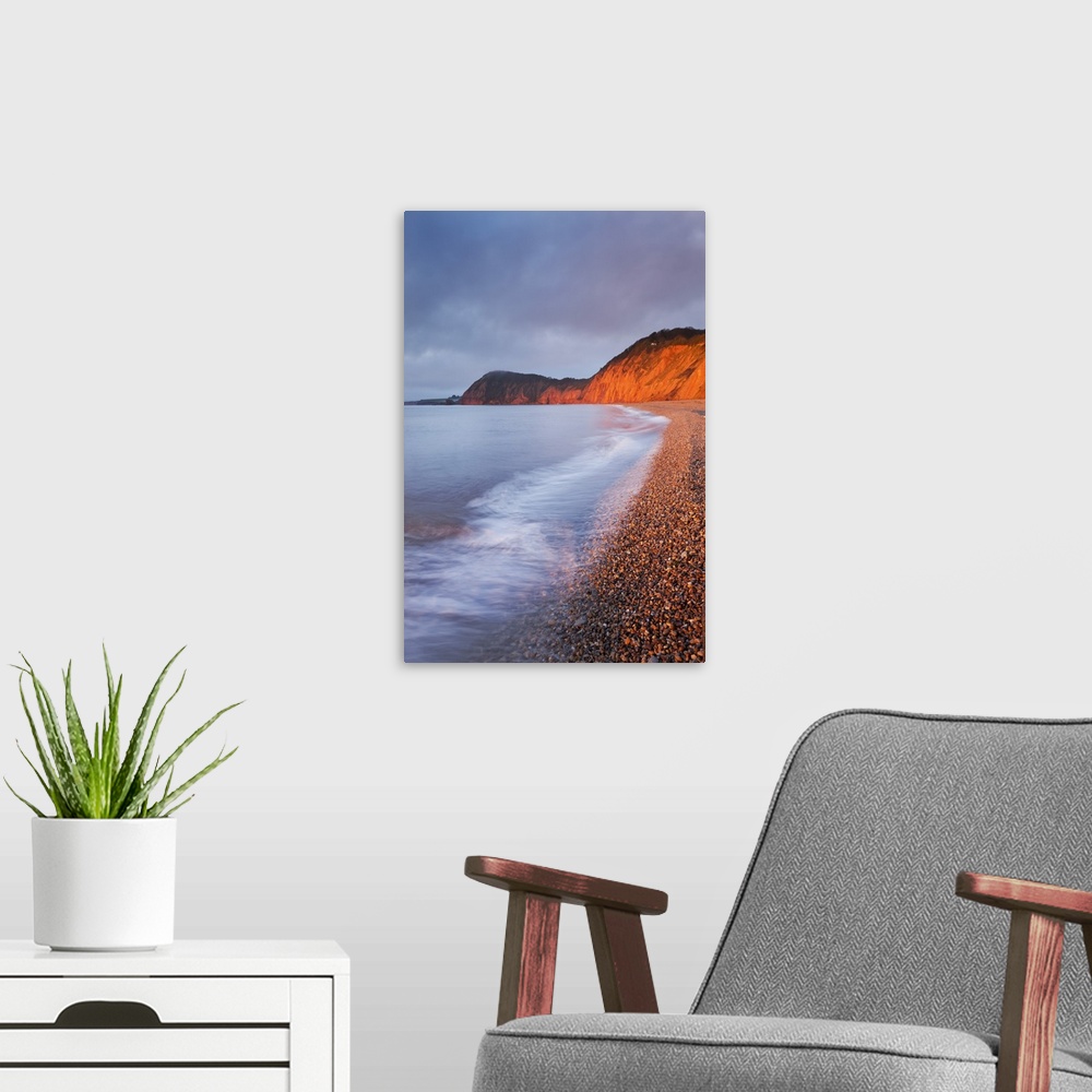 A modern room featuring Burning red cliffs at Sidmouth on the Jurassic Coast, Devon, England. Winter