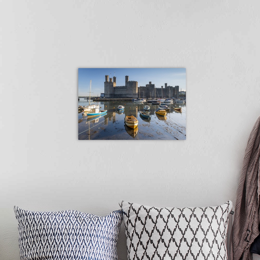 A bohemian room featuring Caernarvon Castle and boats, Snowdonia, Wales, UK