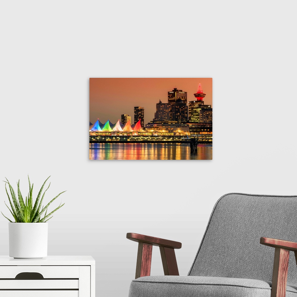 A modern room featuring View at sunset of Canada Place and Harbour Centre building decorated with Christmas lights, Vanco...
