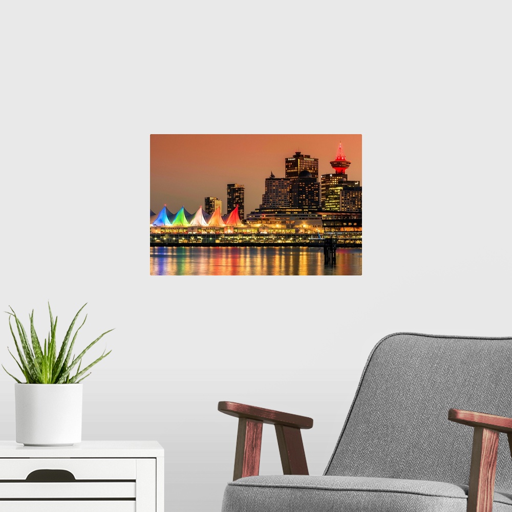 A modern room featuring View at sunset of Canada Place and Harbour Centre building decorated with Christmas lights, Vanco...