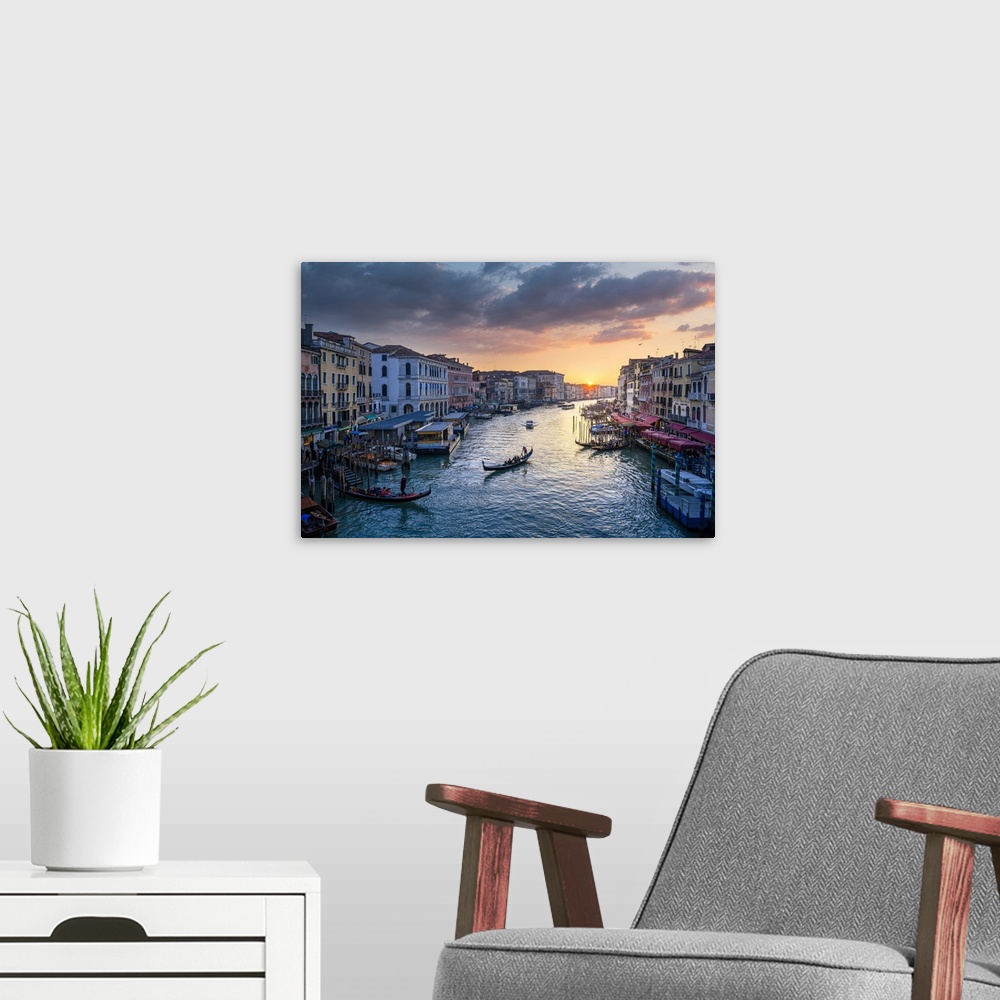 A modern room featuring Canal grande at sunset near Rialto Bridge, Venice, Veneto, Italy.