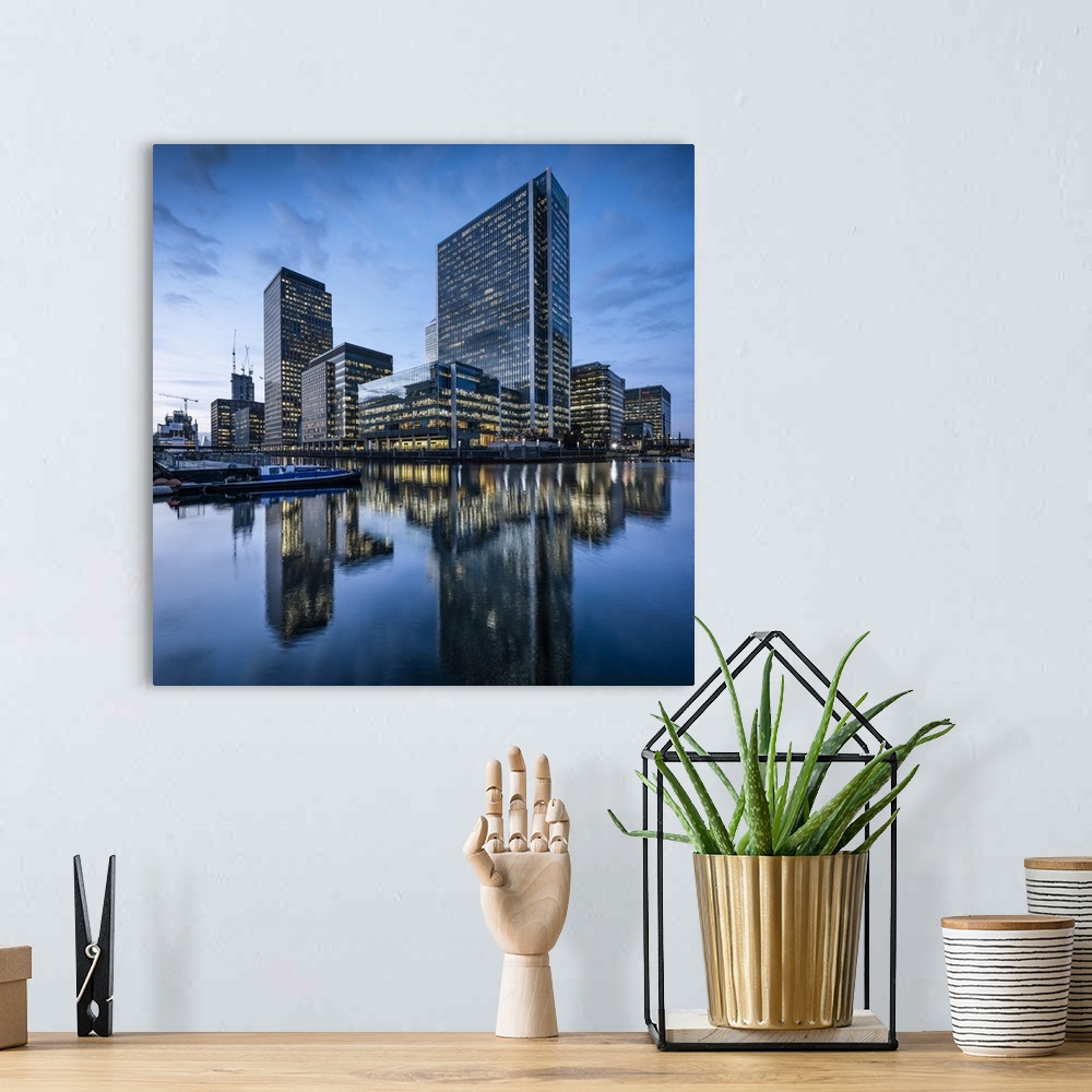 A bohemian room featuring Canary Wharf at dusk, Docklands, London, UK