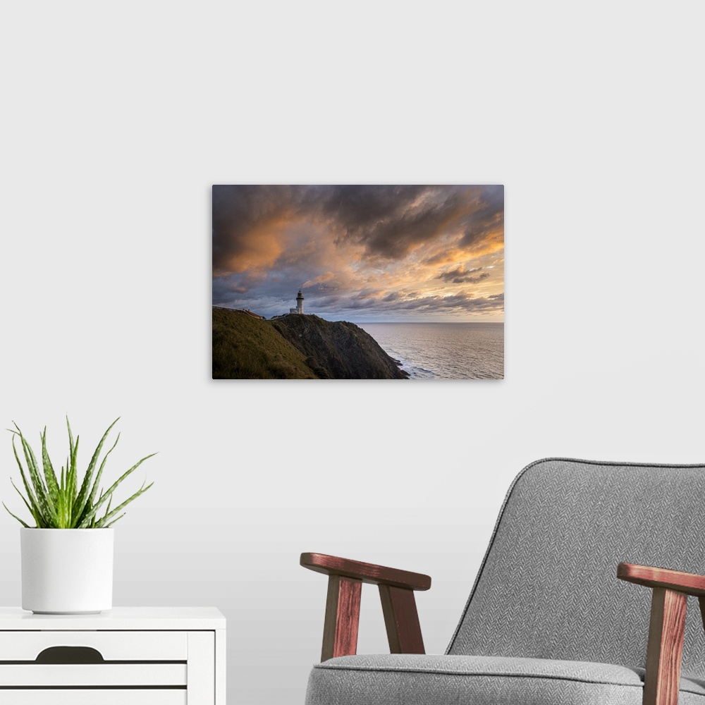 A modern room featuring Cape Byron Lighthouse at sunrise, Byron Bay, New South Wales, Australia.