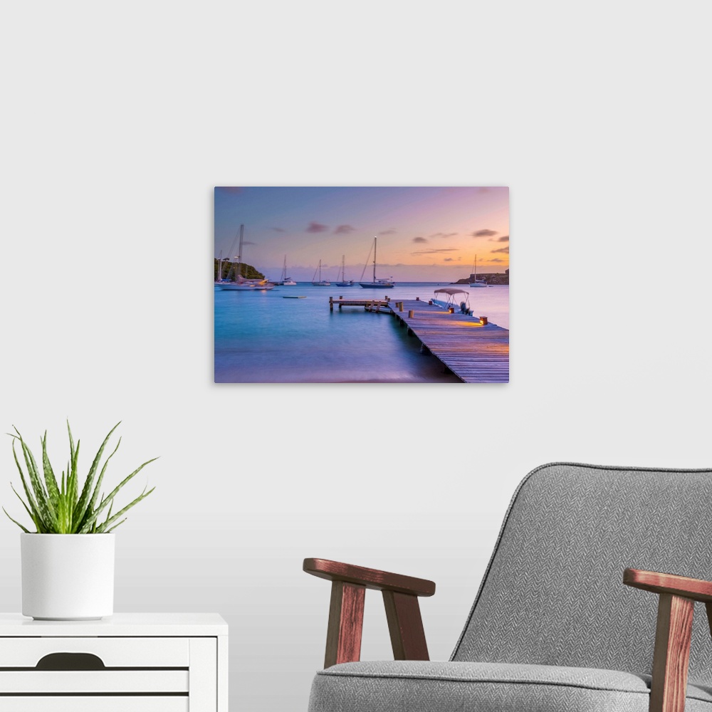 A modern room featuring Caribbean, Antigua, Freeman's Bay, Galleon Beach at dusk.