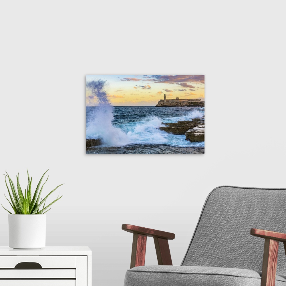 A modern room featuring Castillo De Los Tres Reyes Del Morro (otherwise known as El Morro) at sunrise from The Malecon, L...
