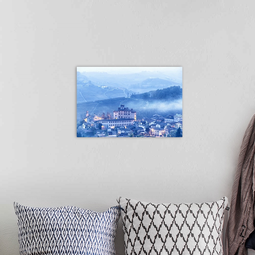A bohemian room featuring Castle and village of Barolo during a foggy dusk. Barolo wine region, Langhe, Piedmont, Italy, Eu...