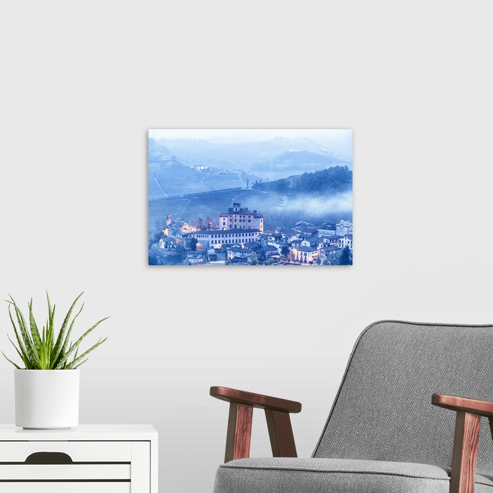 A modern room featuring Castle and village of Barolo during a foggy dusk. Barolo wine region, Langhe, Piedmont, Italy, Eu...