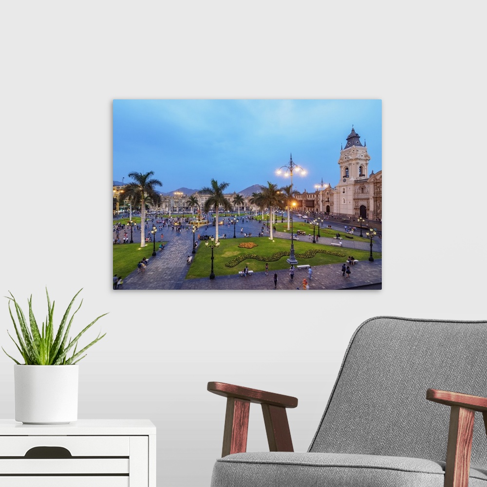 A modern room featuring Cathedral and Plaza de Armas at twilight, elevated view, Lima, Peru