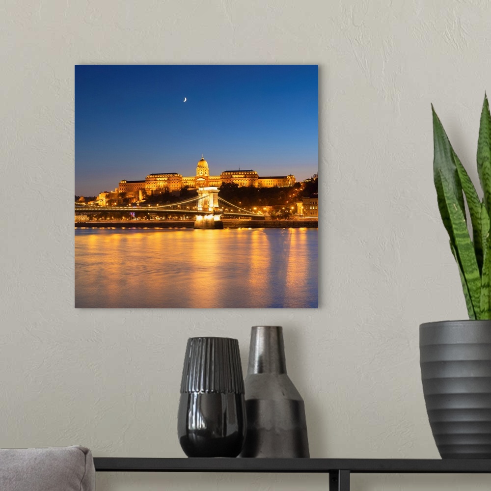 A modern room featuring Chain Bridge (Szechenyi Lanchid) and Buda Castle at dusk, Budapest, Hungary.