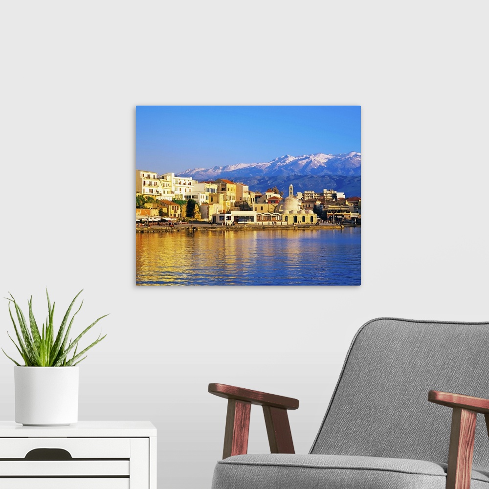 A modern room featuring Chania waterfront and mountains in background, Chania, Crete, Greece, Europe