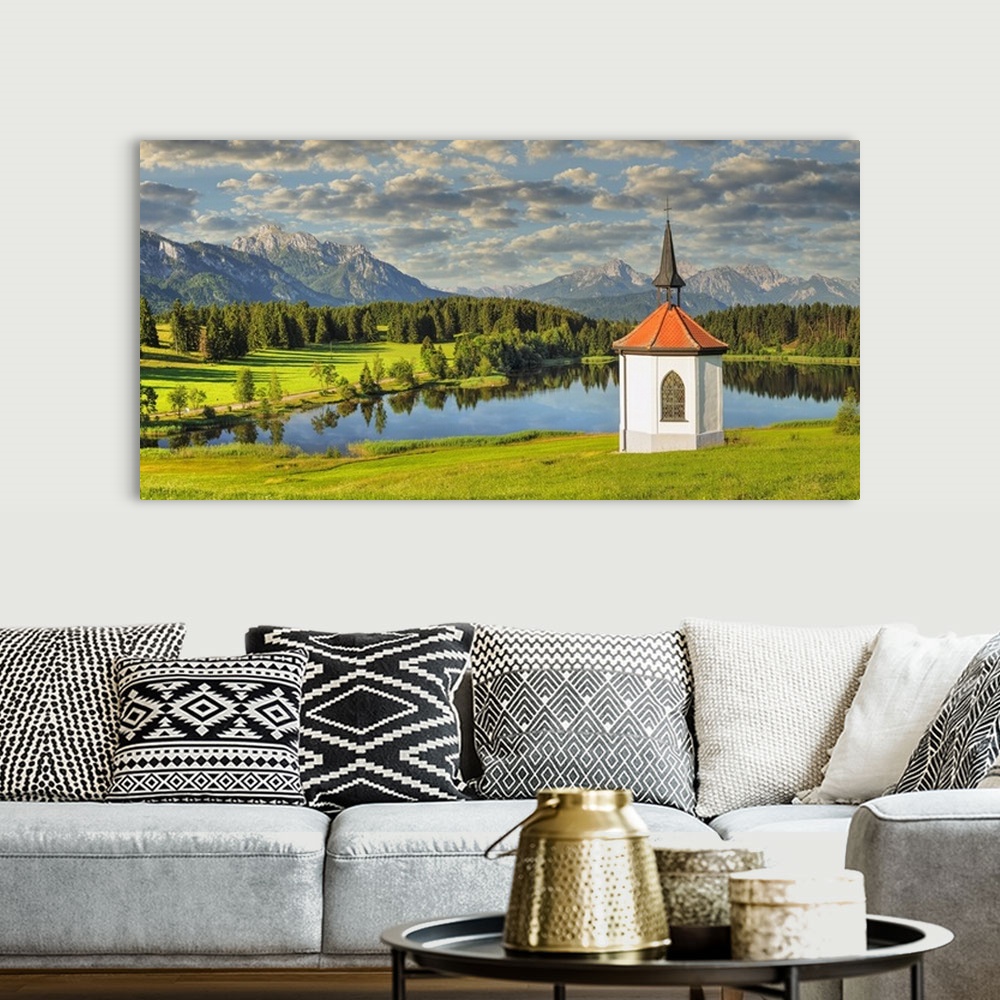 A bohemian room featuring Chapel at Hergratsrieder See Lake, Allgau, Swabia, Bavaria, Germany.