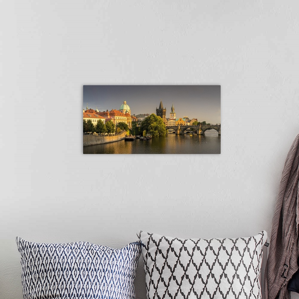 A bohemian room featuring Charles Bridge and Church of Saint Francis of Assisi with Old Town Bridge Tower against dark clou...