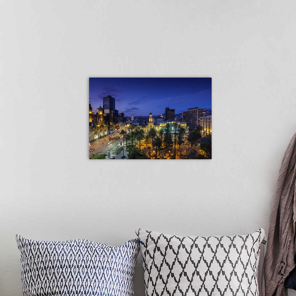 A bohemian room featuring Chile, Santiago, Plaza de Armas and Metropolitan Cathedral, elevated view, dusk
