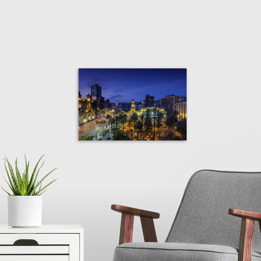 A modern room featuring Chile, Santiago, Plaza de Armas and Metropolitan Cathedral, elevated view, dusk